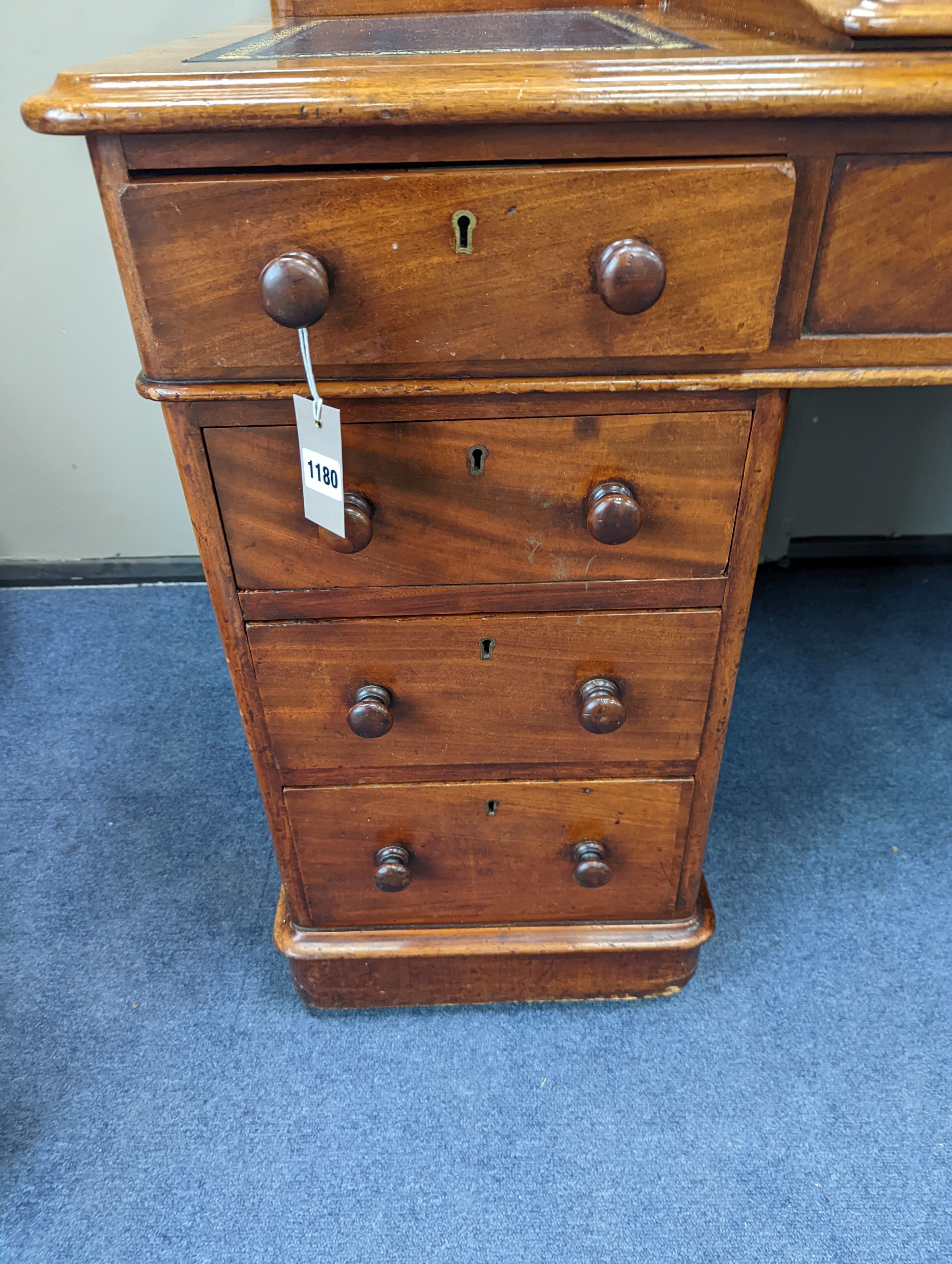 A Victorian ‘Dickens’ mahogany pedestal desk, width 137cm, height 87cm